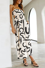 Krishelle Doodle Printed Cutout Waist Pocketed Loose Midi Dress